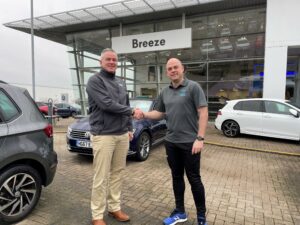 Mark Langford of Breeze Motor Group and Paul O'Connell of Bridge Health and Wellbeing shaking hands
